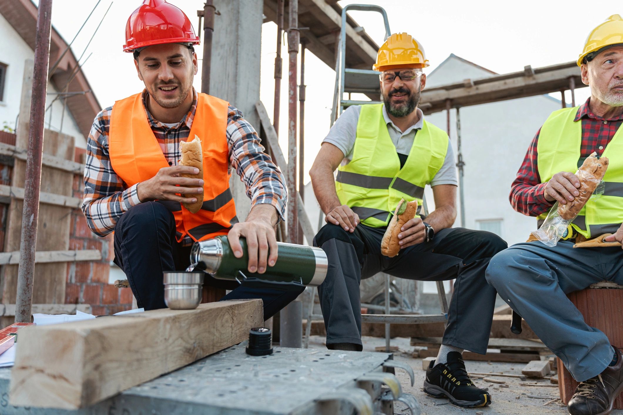Construction professionals on site wearing safety helmets