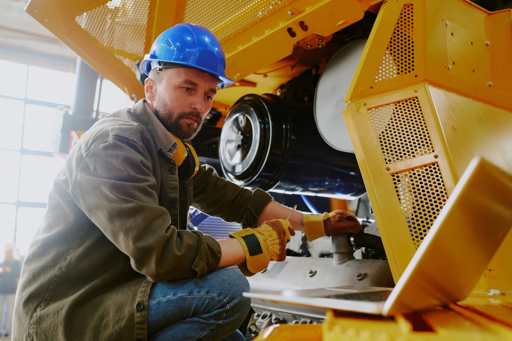 Technician working on industrial machinery