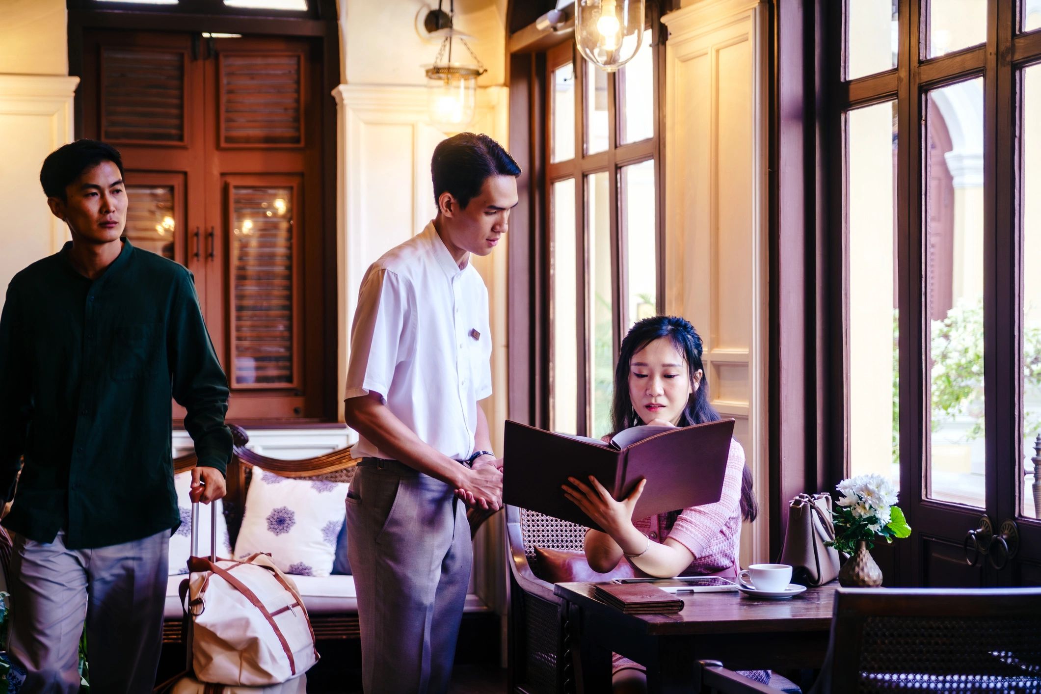 Hospitality staff taking an order in a restaurant